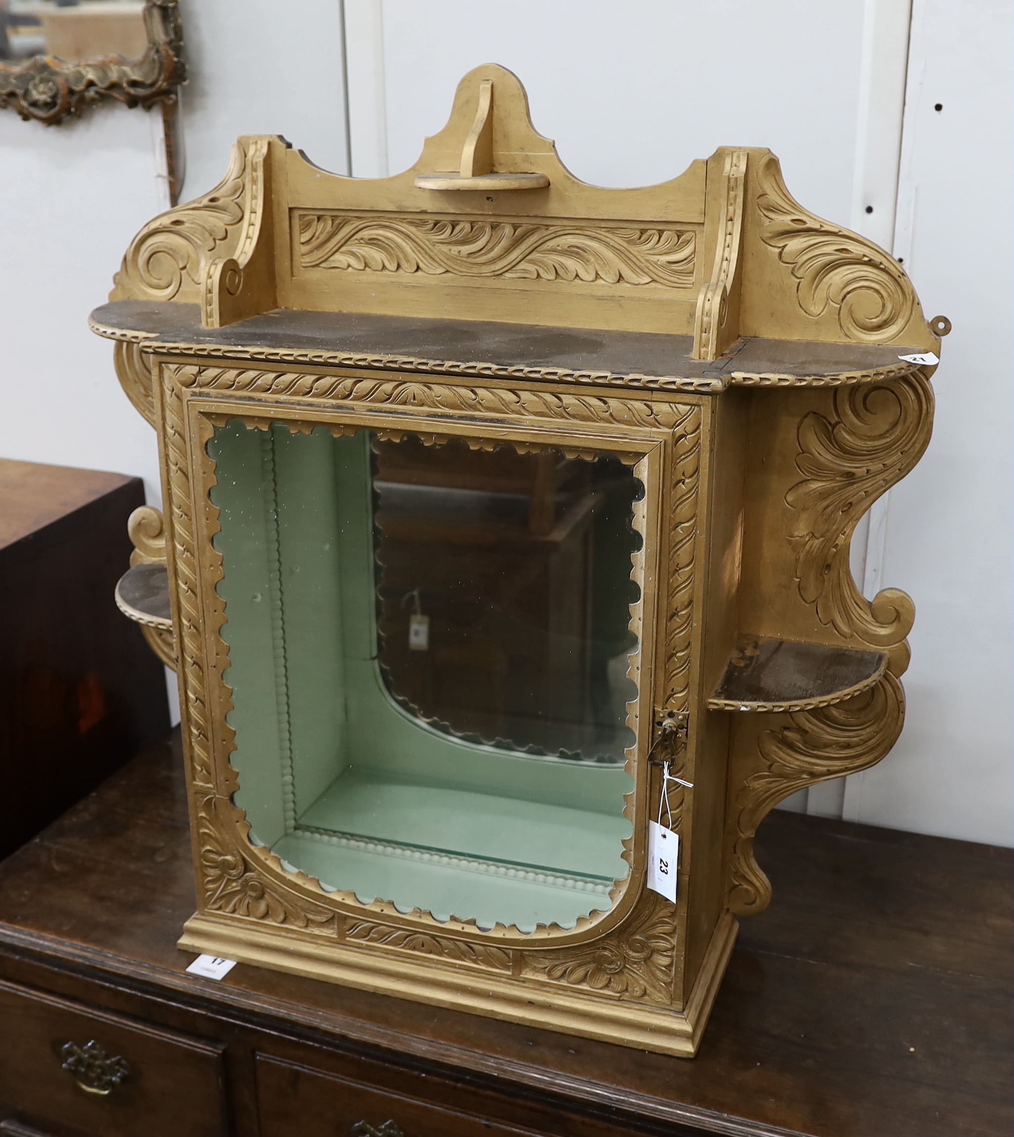 A late Victorian gilt painted carved wall cabinet, width 84cm, height 86cm